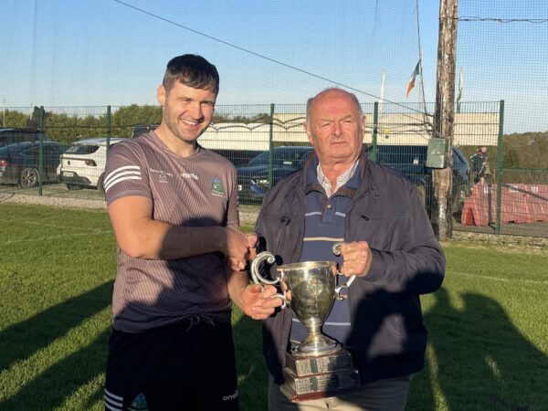 Joe Lynch (Valley Rovers) accepting the Con Murphy Cup from Myles Barry, Chairman of the SE Board